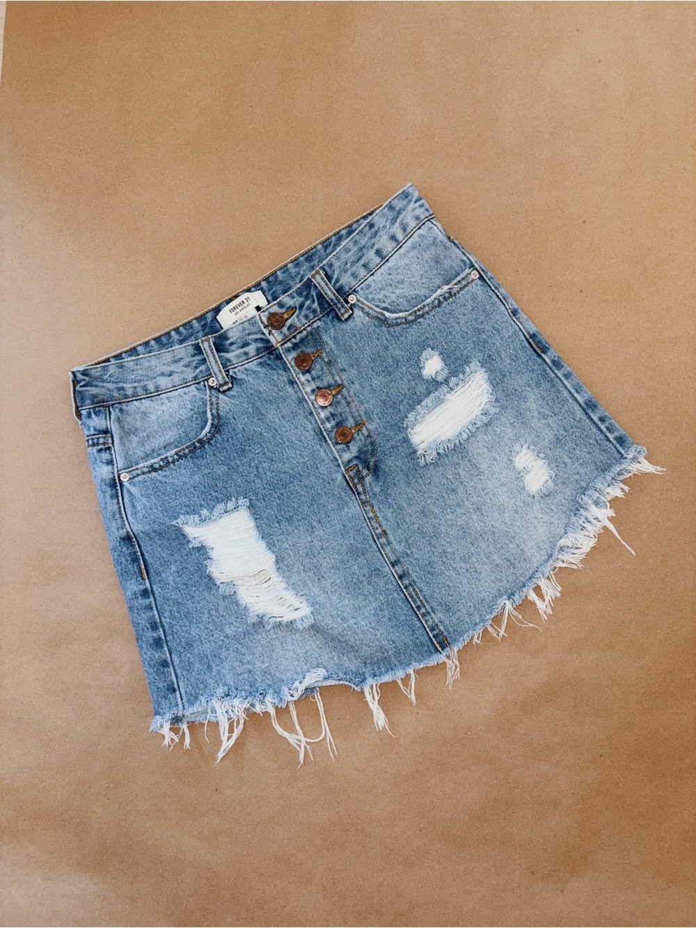 Forever 21 Blue denim mini skirt with button front and distressed details